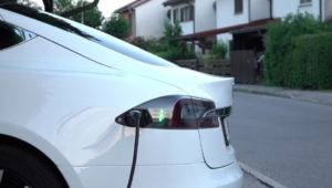 Close Up: Tesla Electric Autonomous Car Filling Batteries At Hom